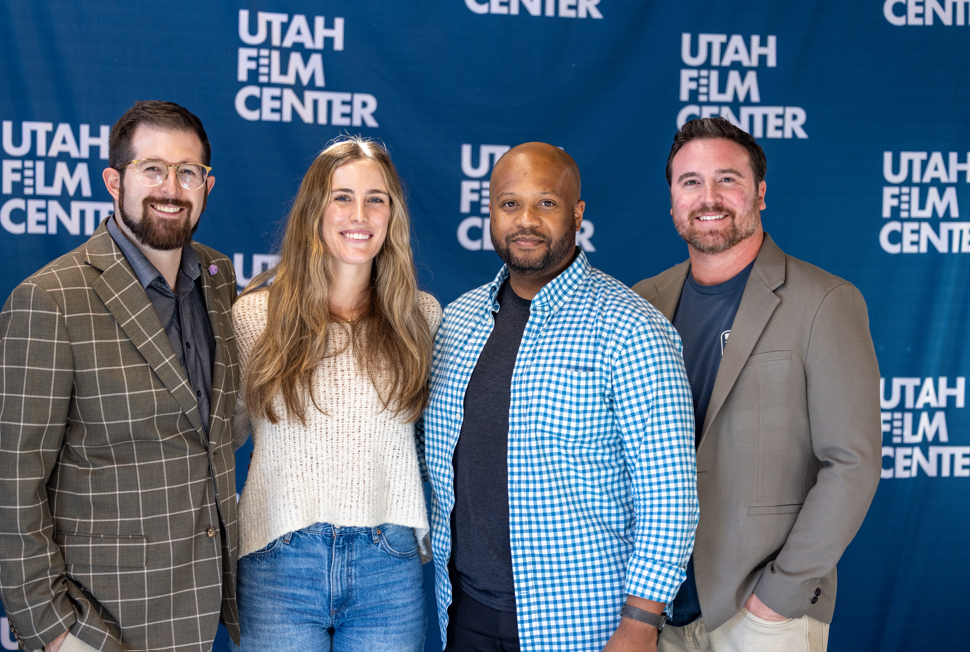 Four BW productions coworkers in front of a Utah Film Center backdrop