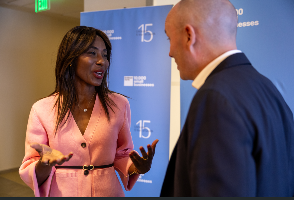 Two people talking at the 10,000 small businesses event