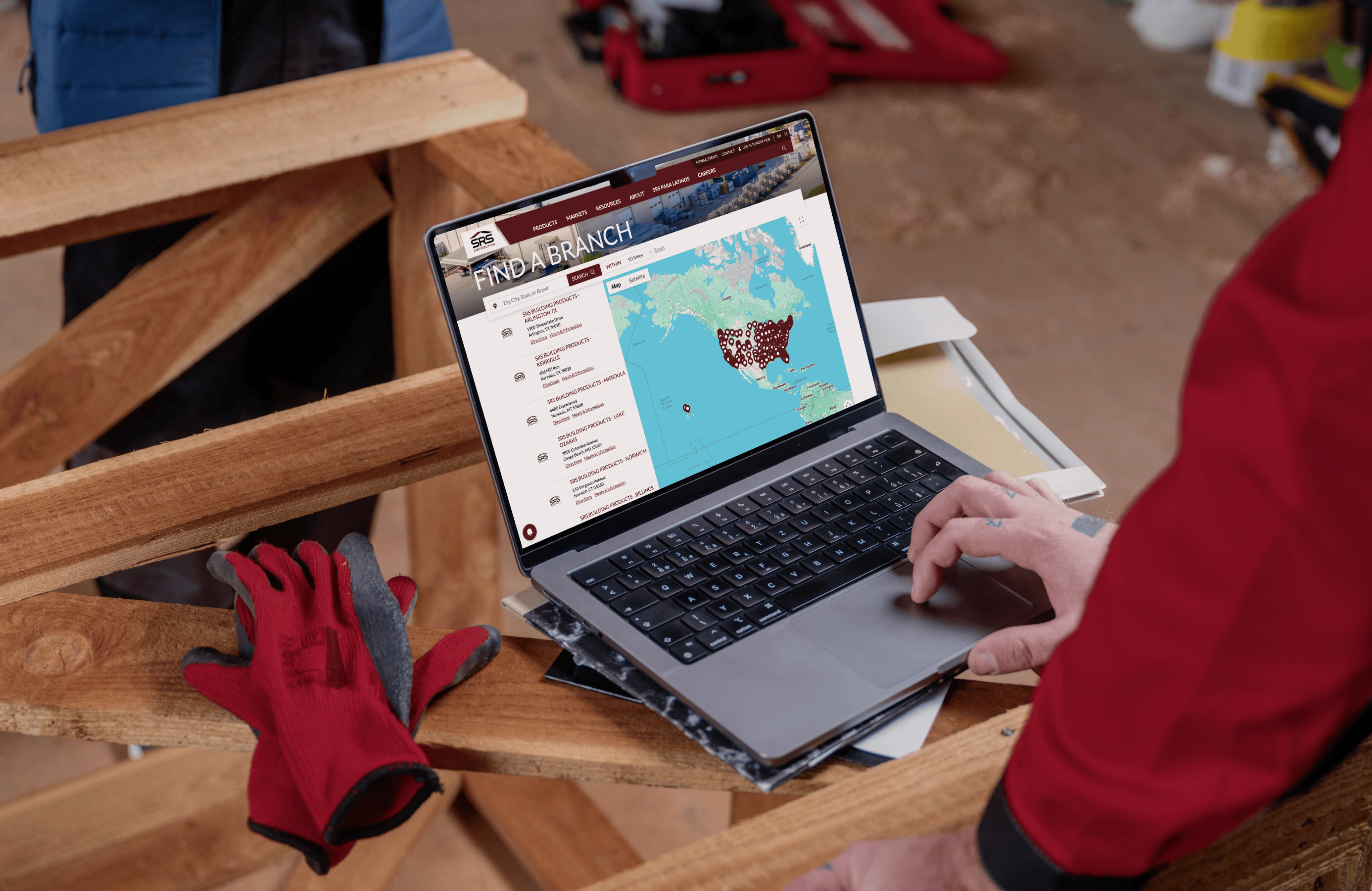 A builder at his workbench using the SRS Find a Branch page to locate nearby SRS Distribution centers.