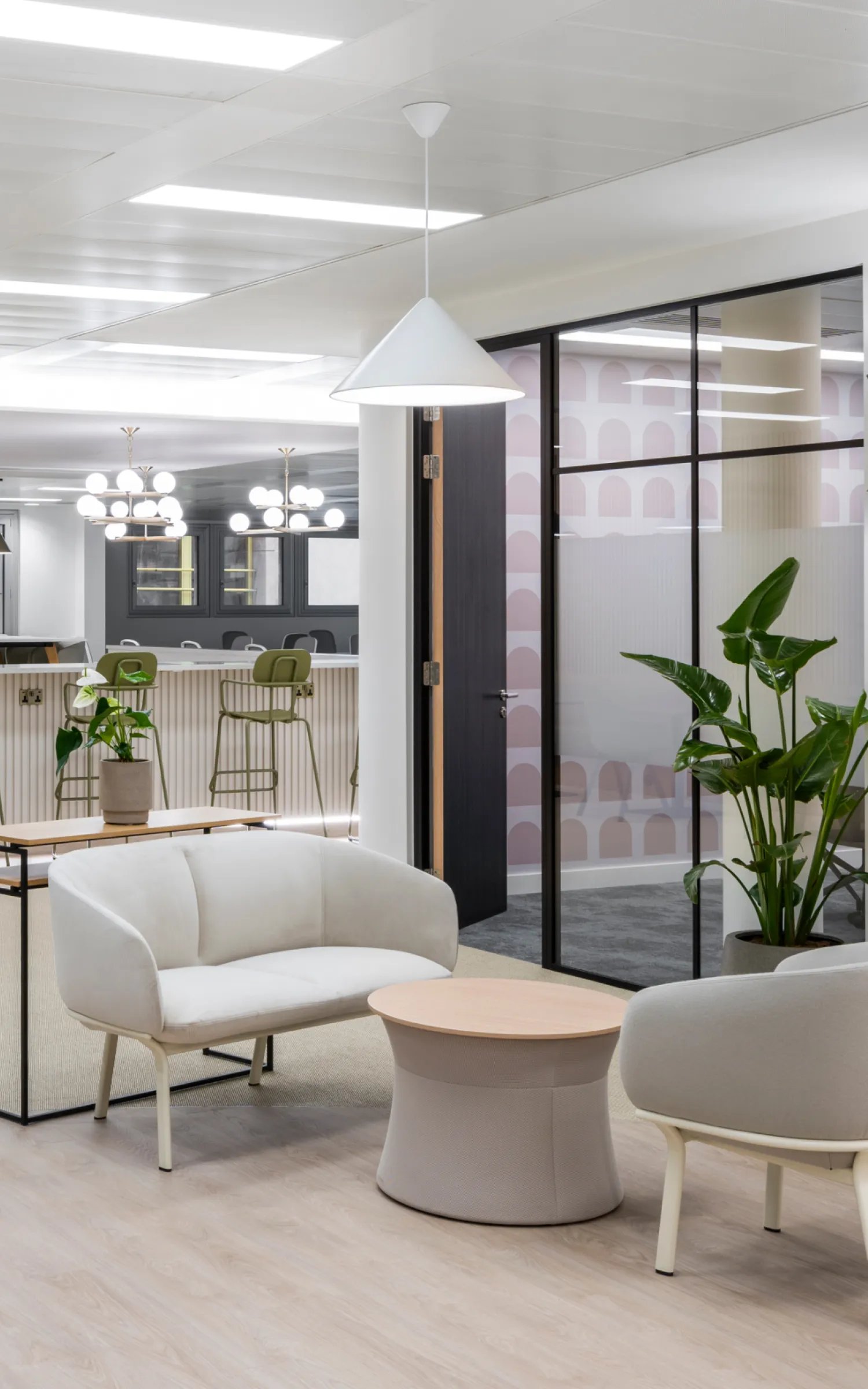 A commercial interior with furniture and plants.