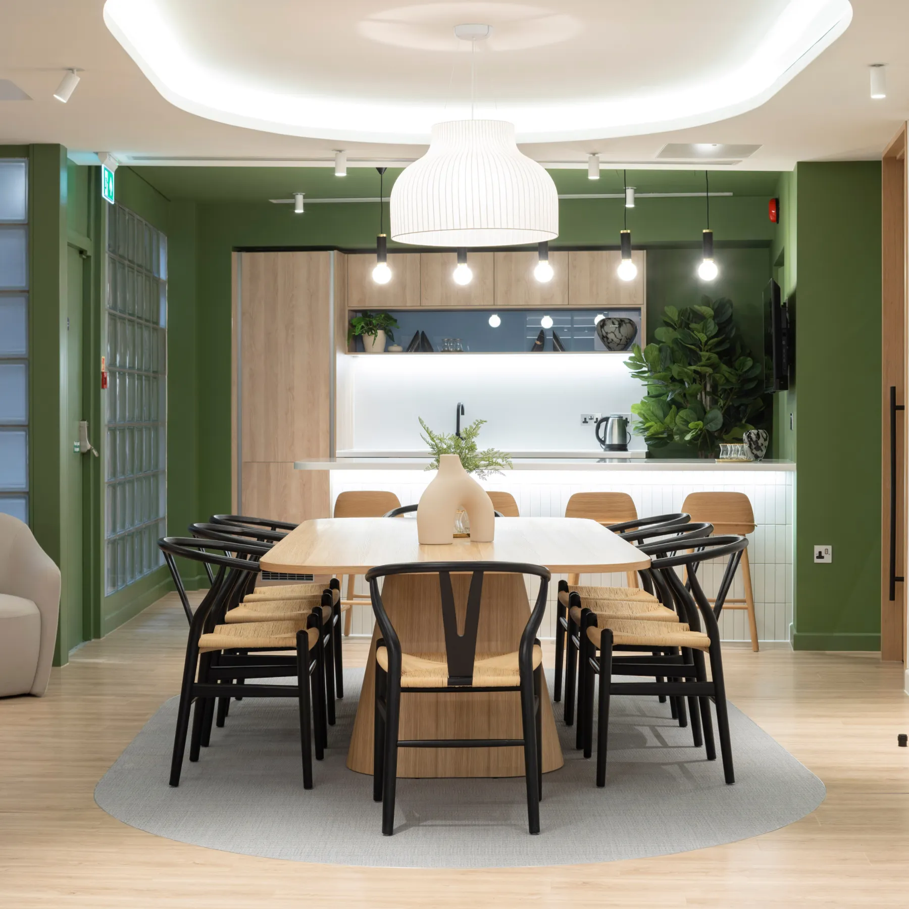 An office space with a table and chairs.