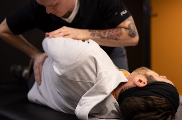 athlete receiving manual therapy at a physical therapy clinic