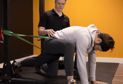 Patient working with a provider at a sports physical therapy clinic in Bismarck, ND