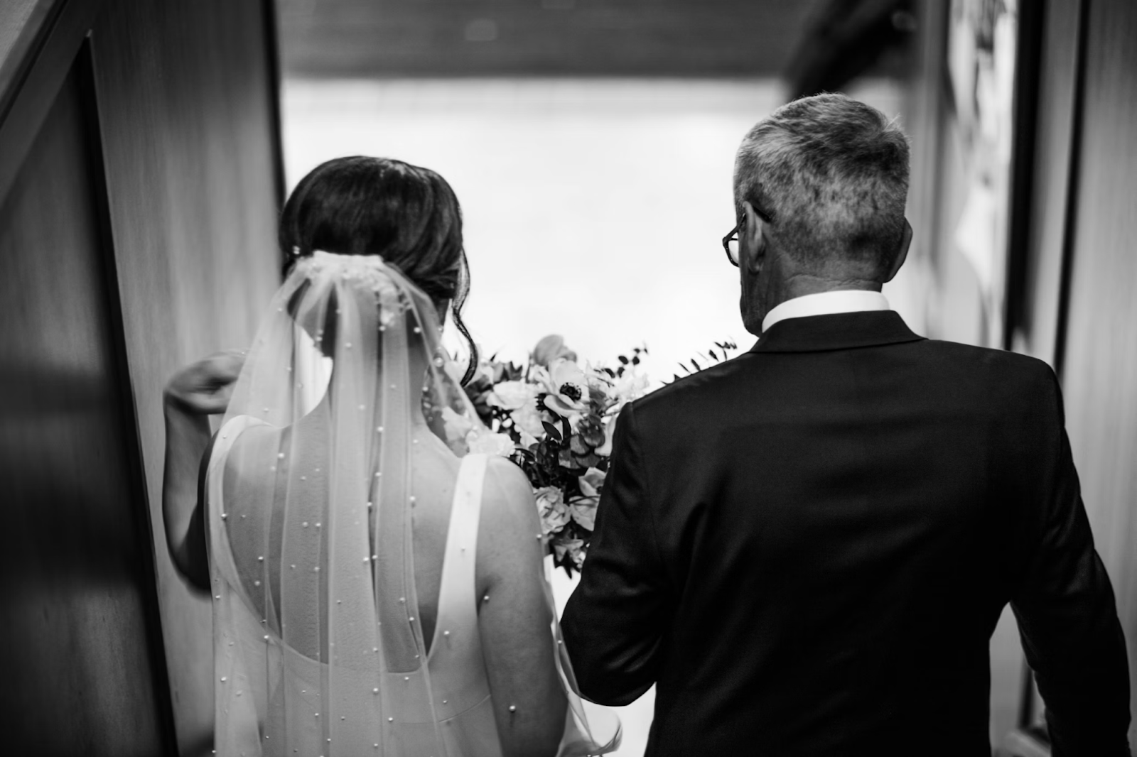 Father walking daughter down the aisle before his wedding speech.