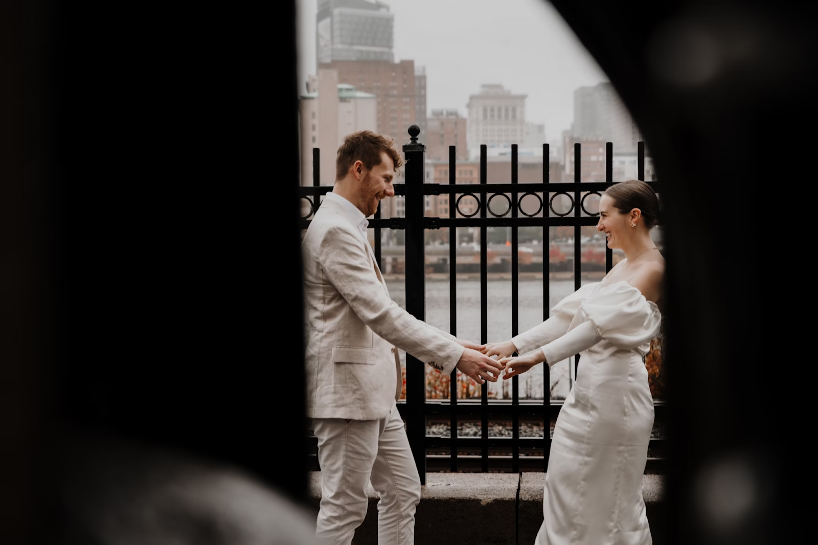 Romantic wedding vows examples – Ethan and Grace holding hands and laughing during their outdoor wedding ceremony