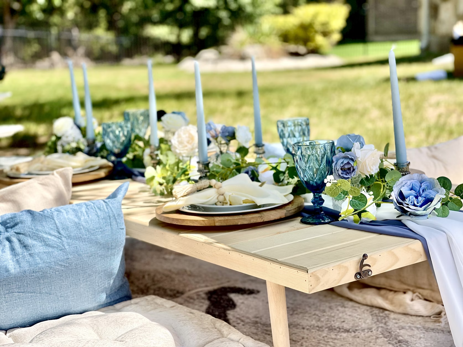 Elegant outdoor setup for planning a destination wedding with blue and white décor on a budget
