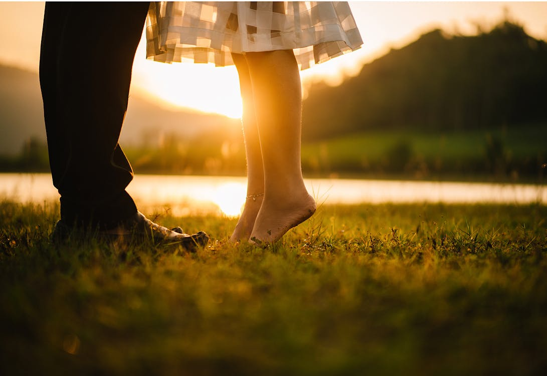 Couple deciding if they should get married during a sunset moment