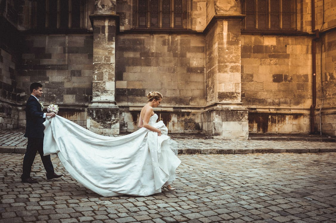 Bride and groom walking together after their ceremony, symbolizing wedding etiquette focused on presence and kindness 