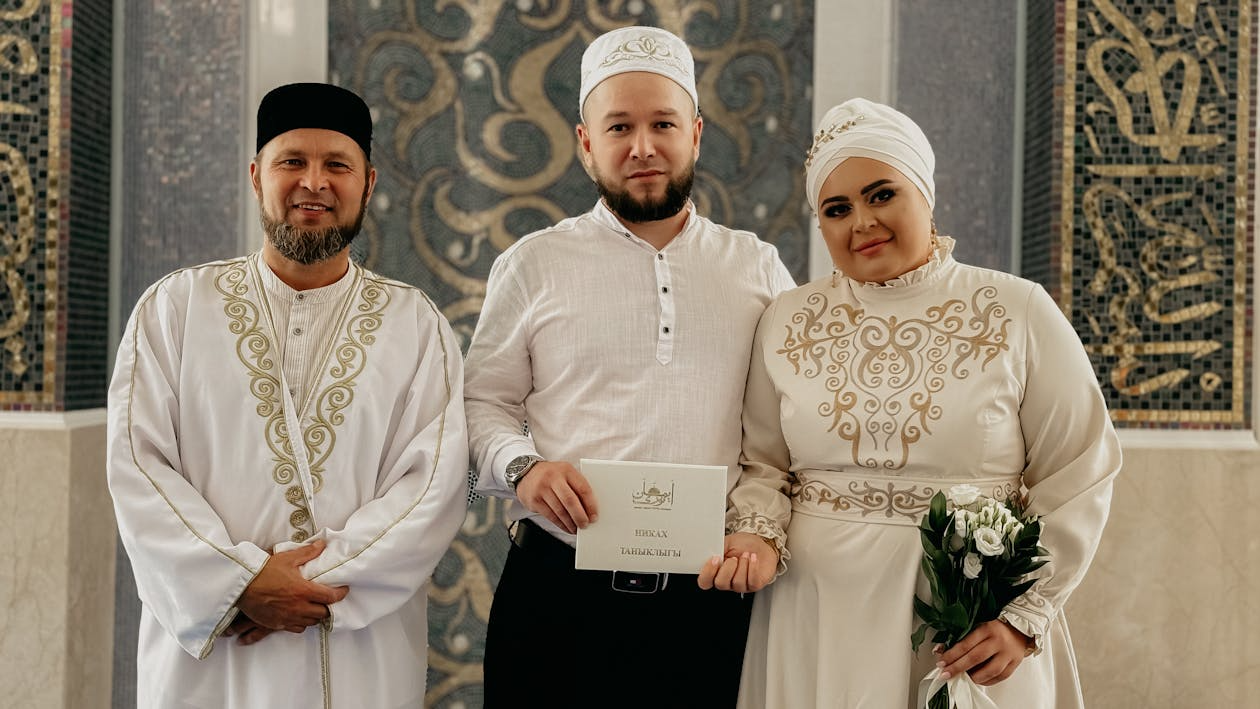 Muslim marriage ceremony with couple and imam after completing Nikah essentials