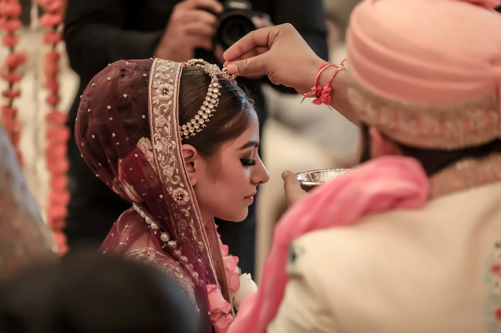 Bride on her wedding day taking part in a religious ceremony.