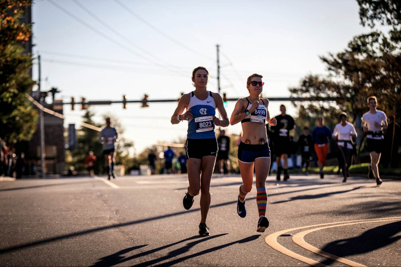 A group of people running a 10K race