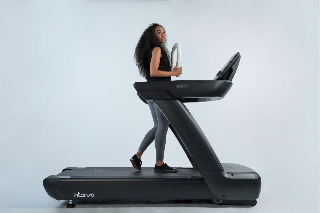 A woman walking on a treadmill