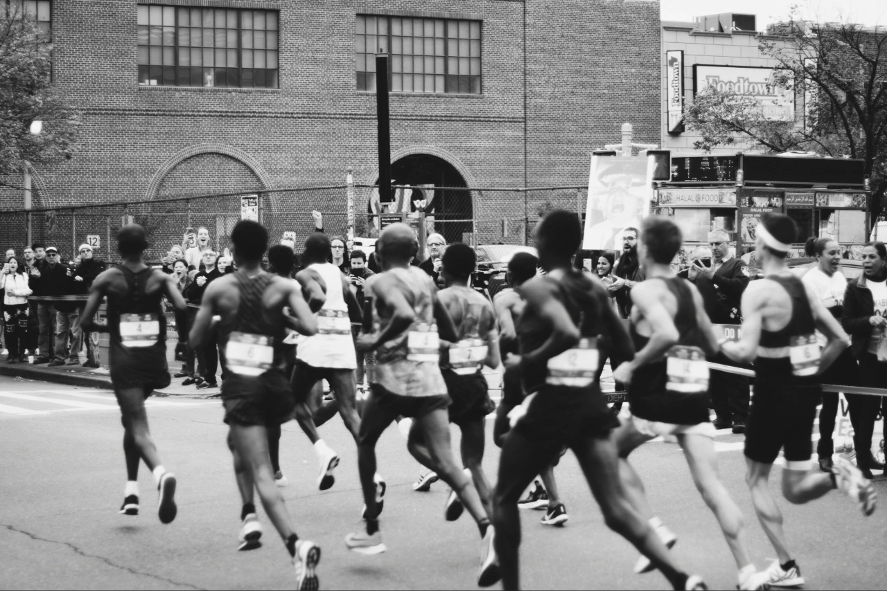 Marathon runners in black and white film photography. 