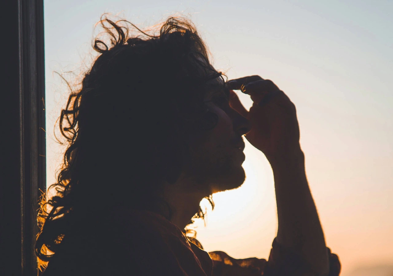 women behind a sunset.