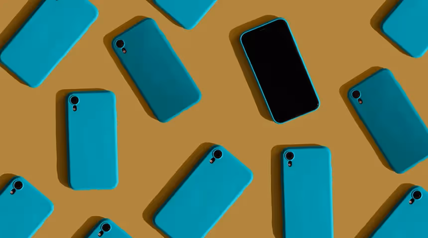 blue phones laying on a yellow background.