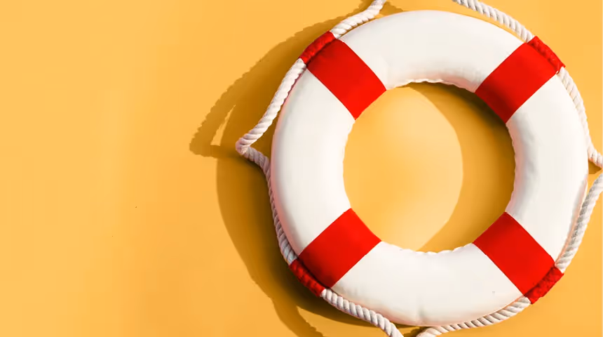white and red lifebuoy on a yellow background.