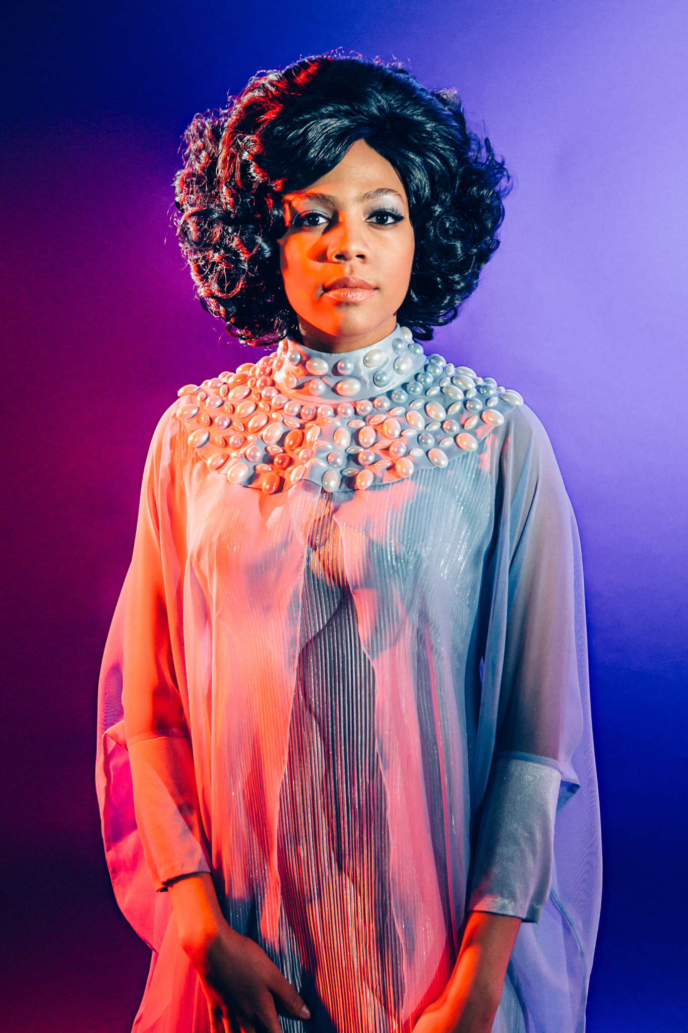 One Dream Girl in portrait orientation with blue and red lighting