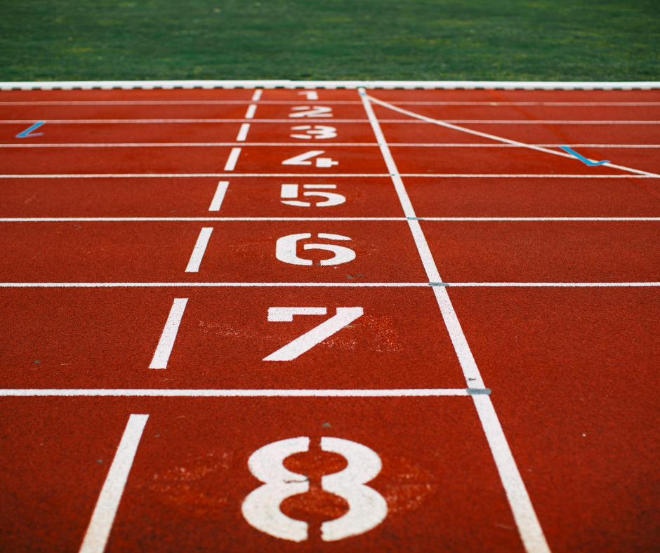 red track starting line with white numbers from one to eight