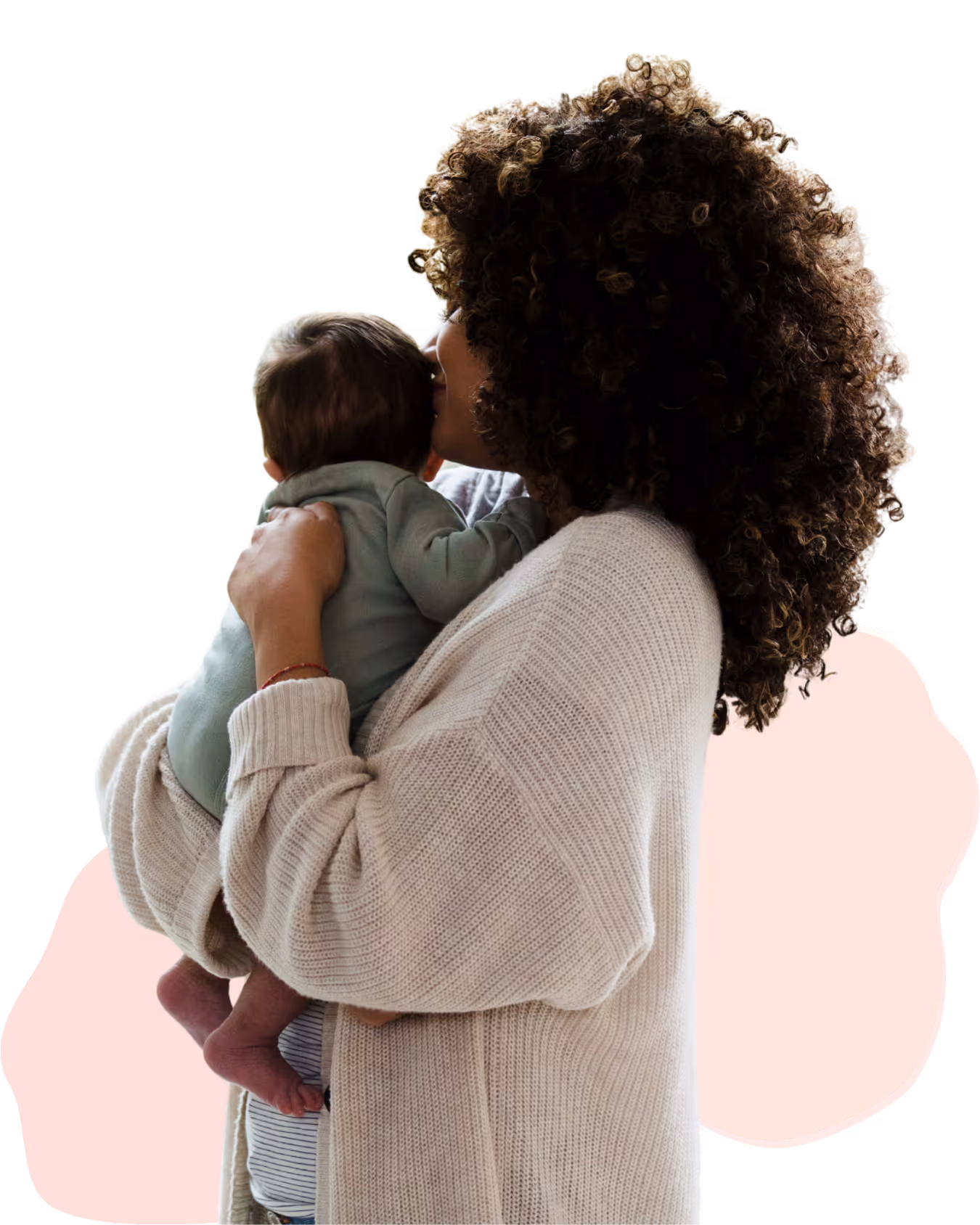 New parents smiling at each other while holding their newborn during early baby feeding journey