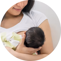 Mom holding up newborn baby
