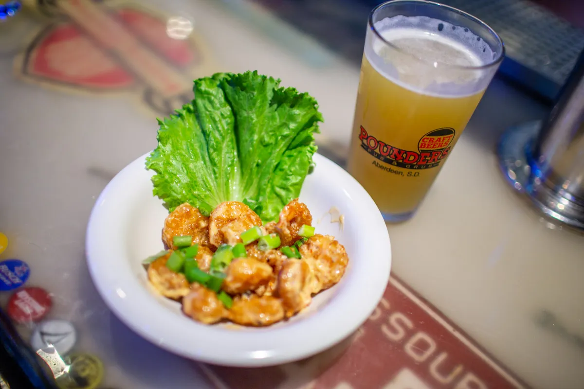 bang bang shrimp appetizer and beer