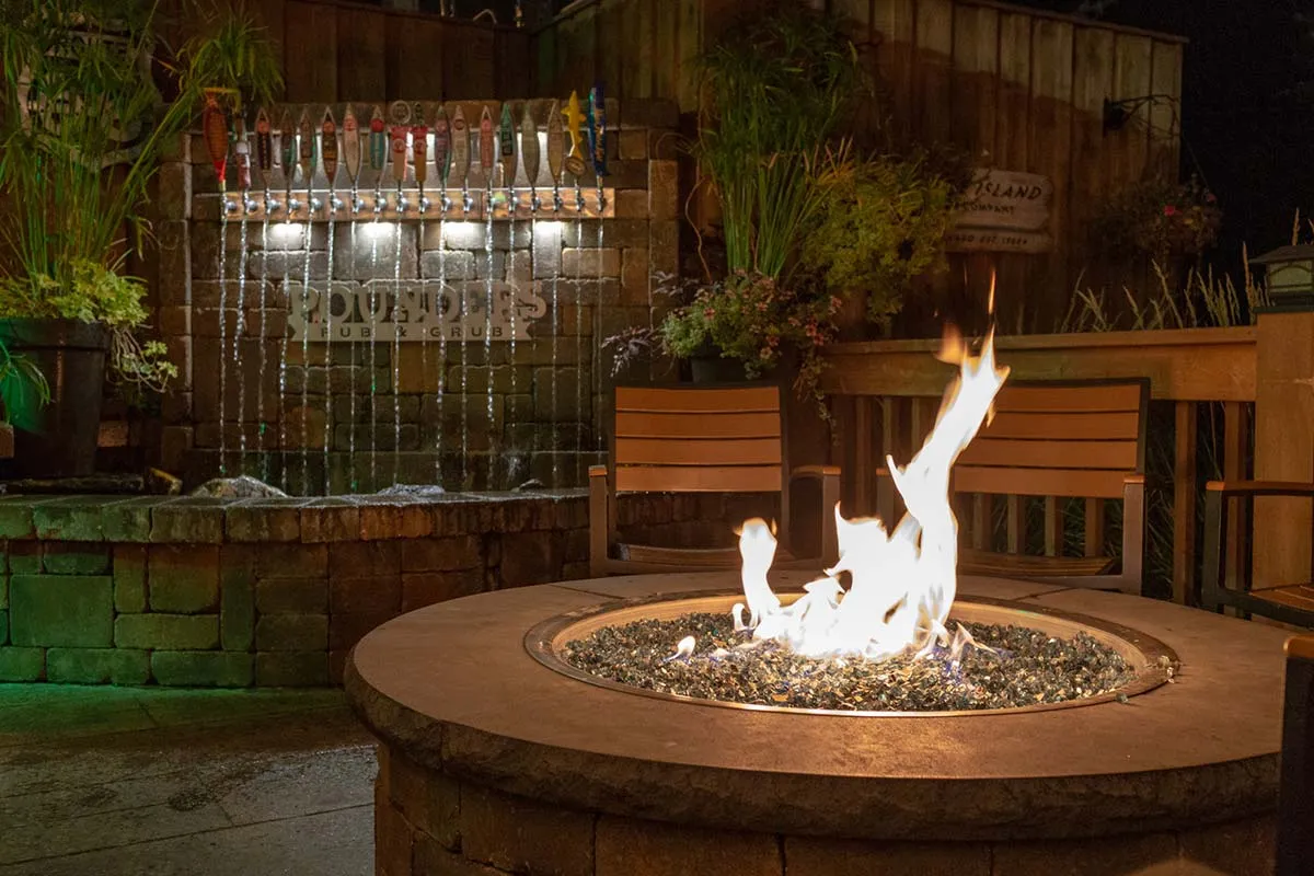 pounders fire patio fire pit and fountain at night