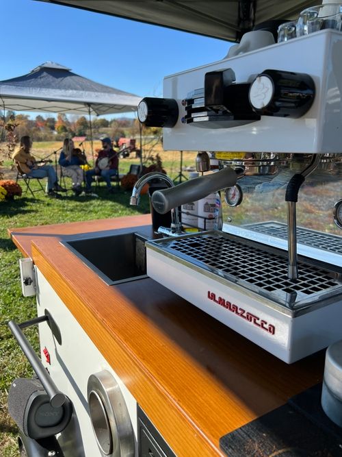 Best Friend Coffee Co. mobile espresso cart set up indoors at a boutique-style event, showcasing a clean, wedding-ready design and full coffee bar service.