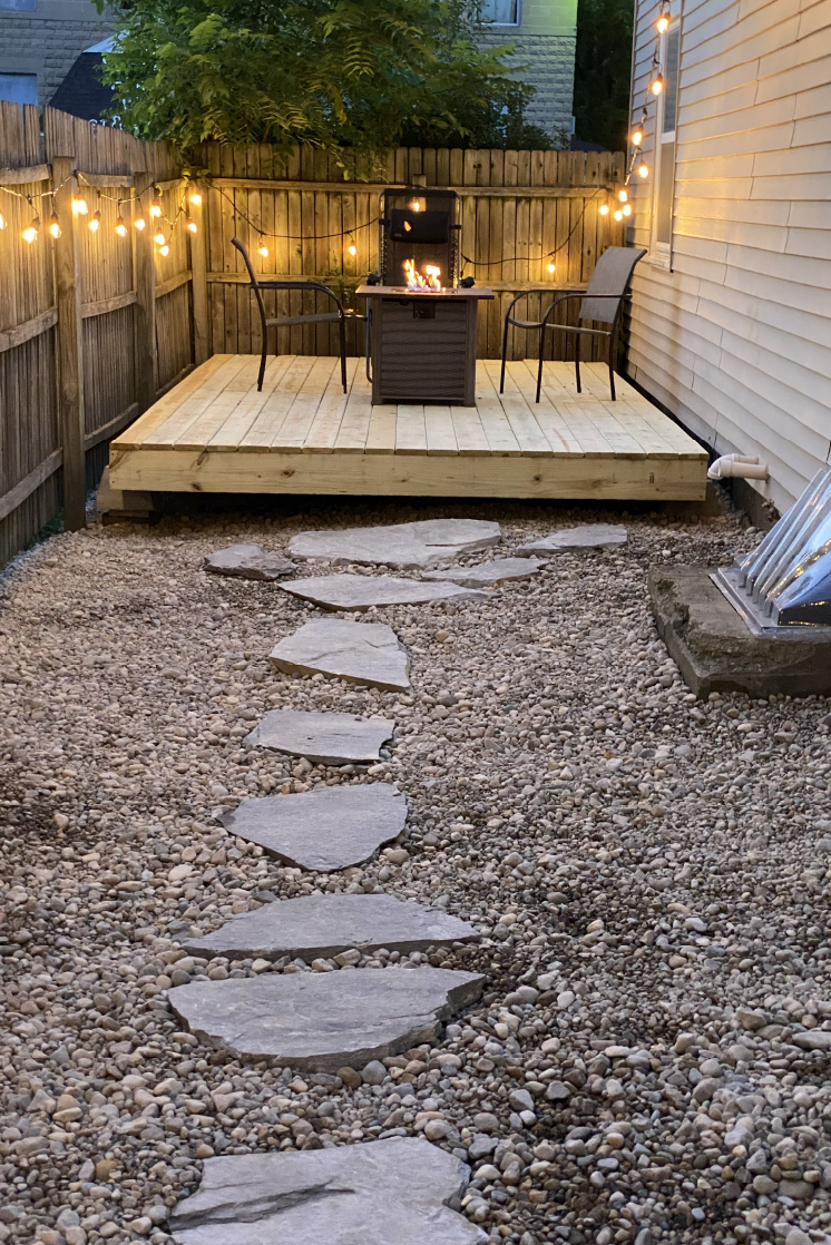 stone path leading to wood sitting area