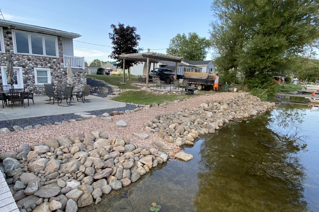 boulders installed on lake shore.