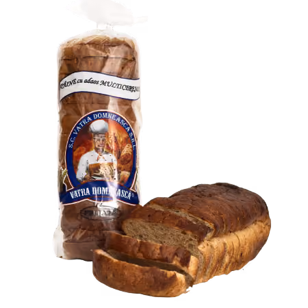 Loaf of multigrain bread, partially sliced, with the packaged loaf behind it showing a label featuring a baker and bread illustrations.