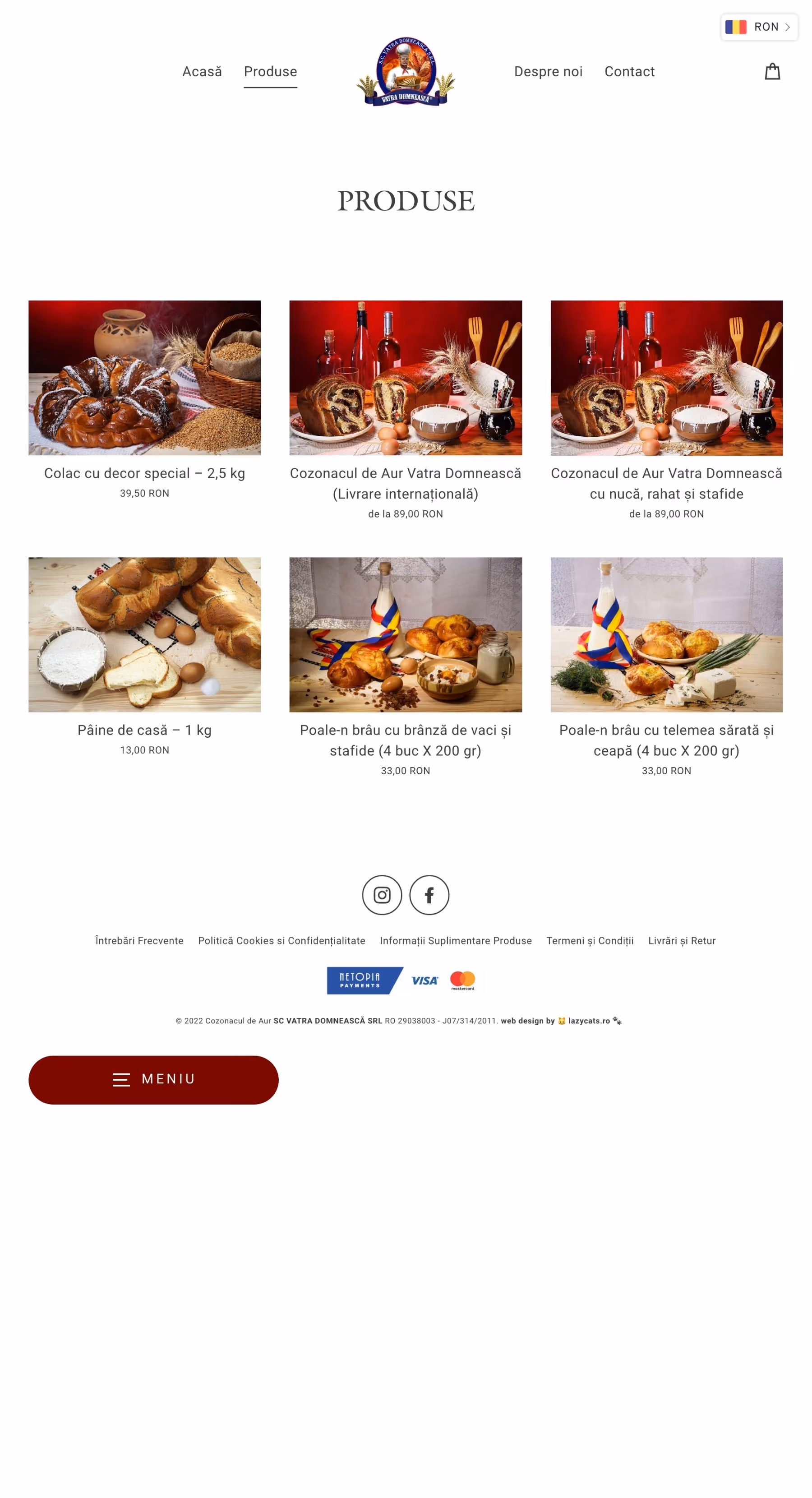 Romanian bakery products including special decorated bread, cozonac with walnut and raisins, homemade bread, and rolls with cheese and onions displayed on a table with decorative and baking elements.