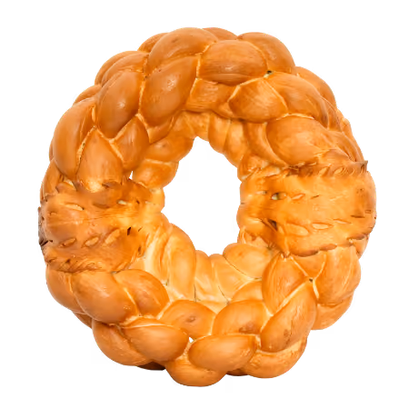 Round braided bread wreath with a golden crust and a hole in the center.