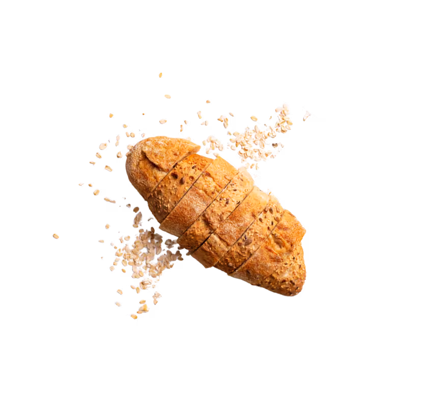 Sliced loaf of multigrain bread surrounded by scattered oats on a transparent background.