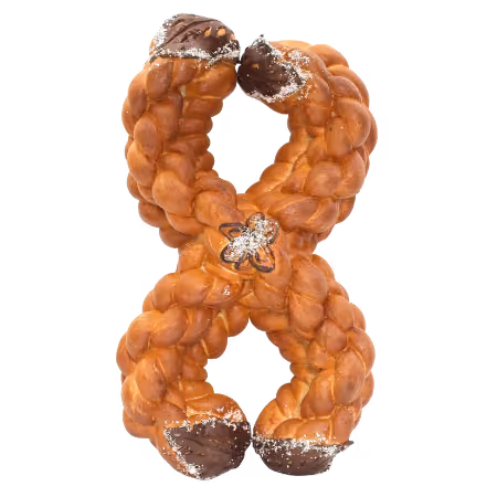 Braided bread shaped like the number 8 with chocolate-dipped ends and a small flower decoration dusted with powdered sugar.