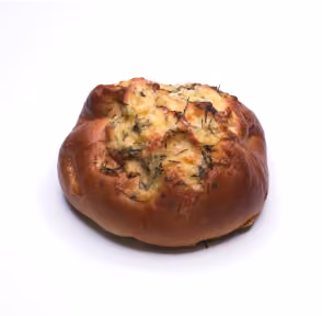 Round bread roll topped with melted cheese and herbs on a white background.