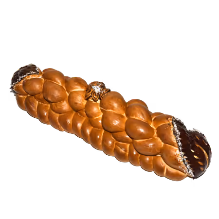 Braided challah bread loaf with one end dipped in chocolate and sprinkled with nuts.