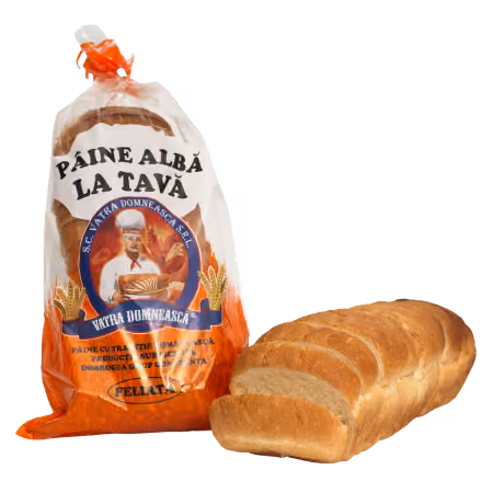 Packaged loaf of white bread labeled Paine Alba La Tava alongside a partially sliced loaf.