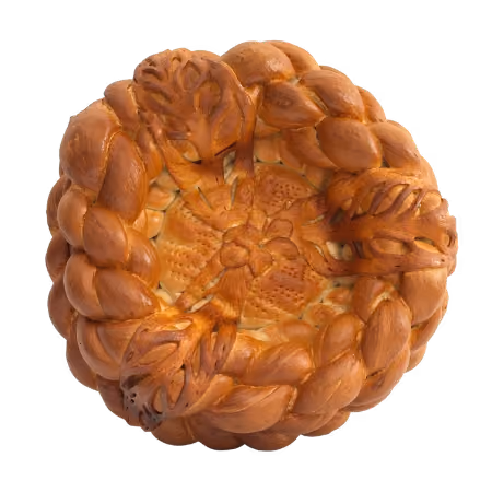 Round braided bread with intricate woven patterns and decorative leaf-shaped dough pieces on top.