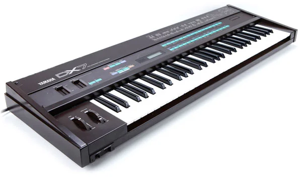 Yamaha DX7 digital synthesizer keyboard with control panel and full key set.