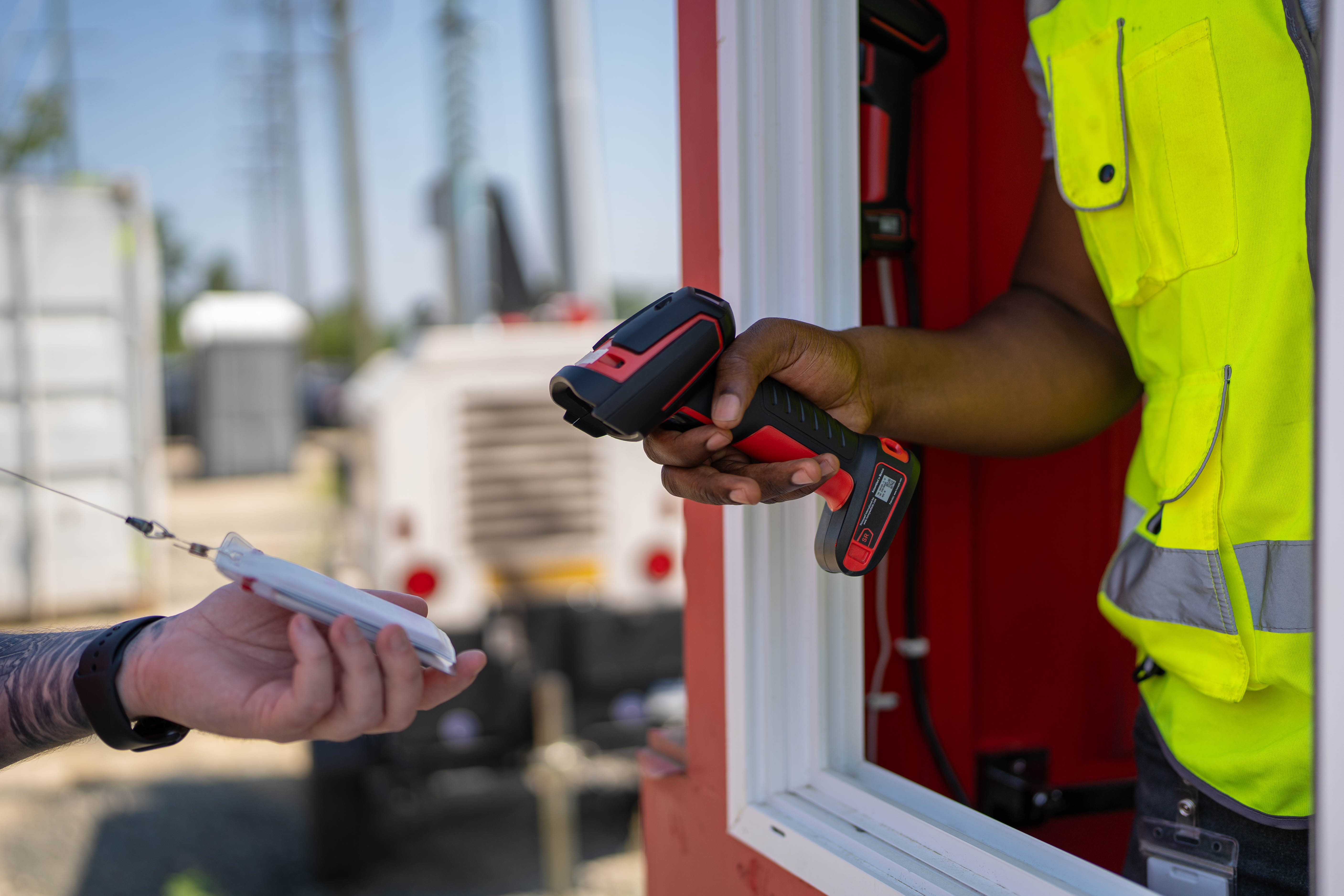 Access control booth staffed at a construction site entrance