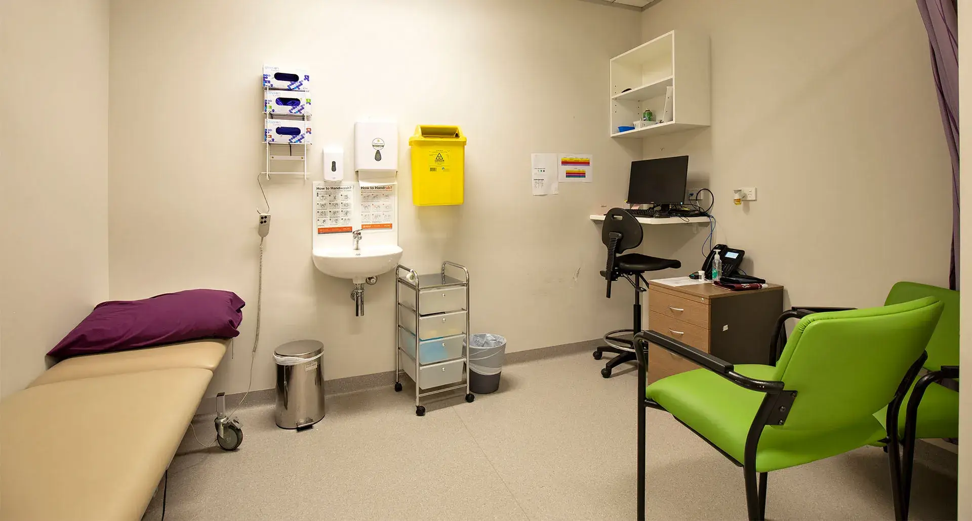 Receptionist at front counter speaking with customer. She is 