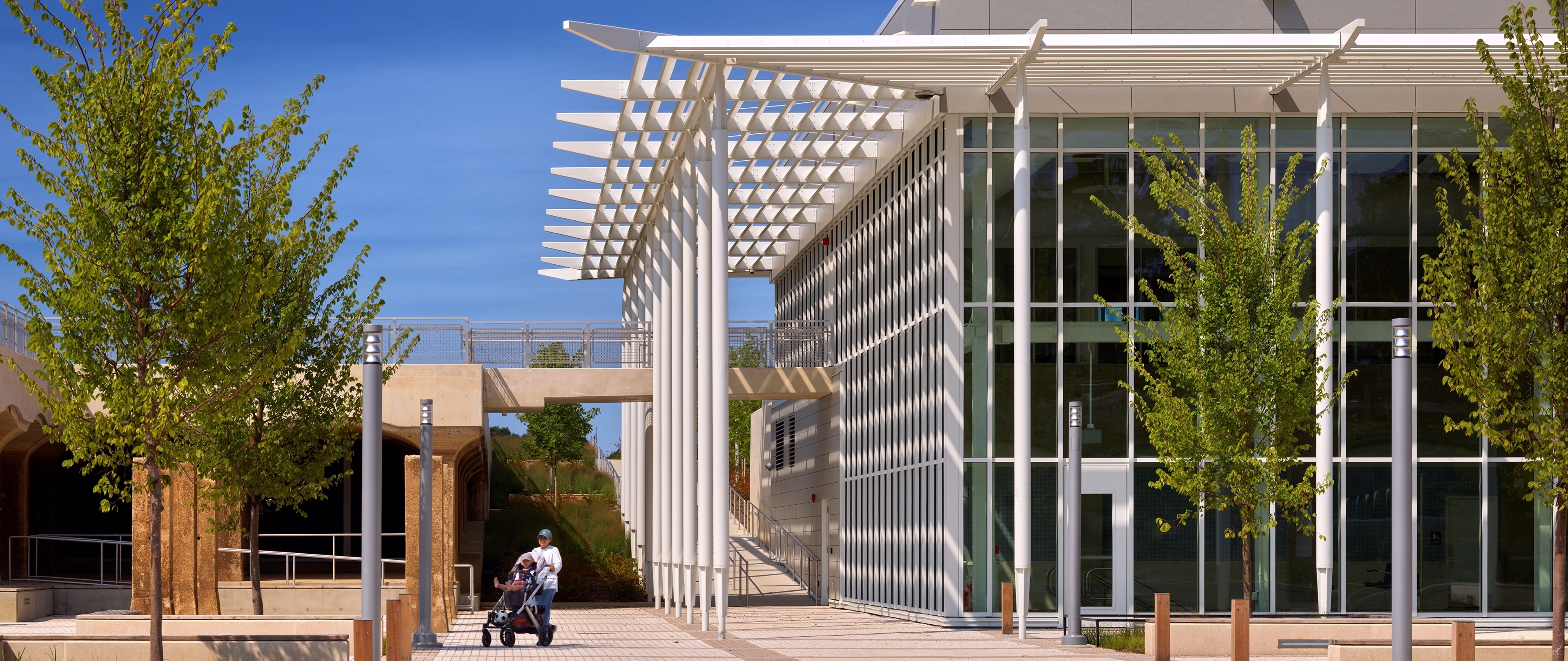 Visitors walk on the plaza near the new recreation center.
