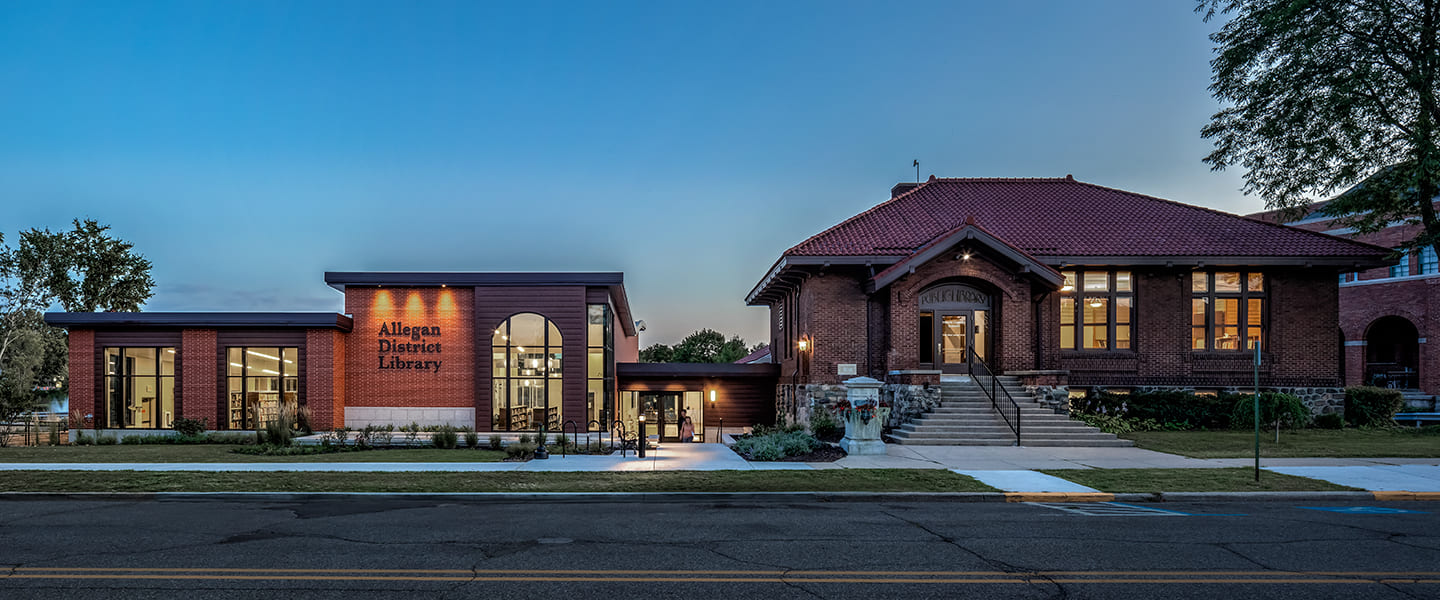 A photo of the exterior of Allegan District Library at night.