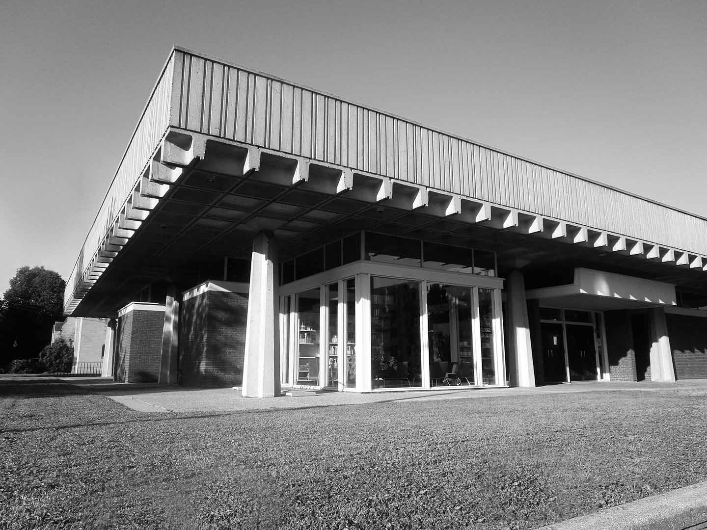 A photo of the original Brutalist architecture of the library designed by Rapson.