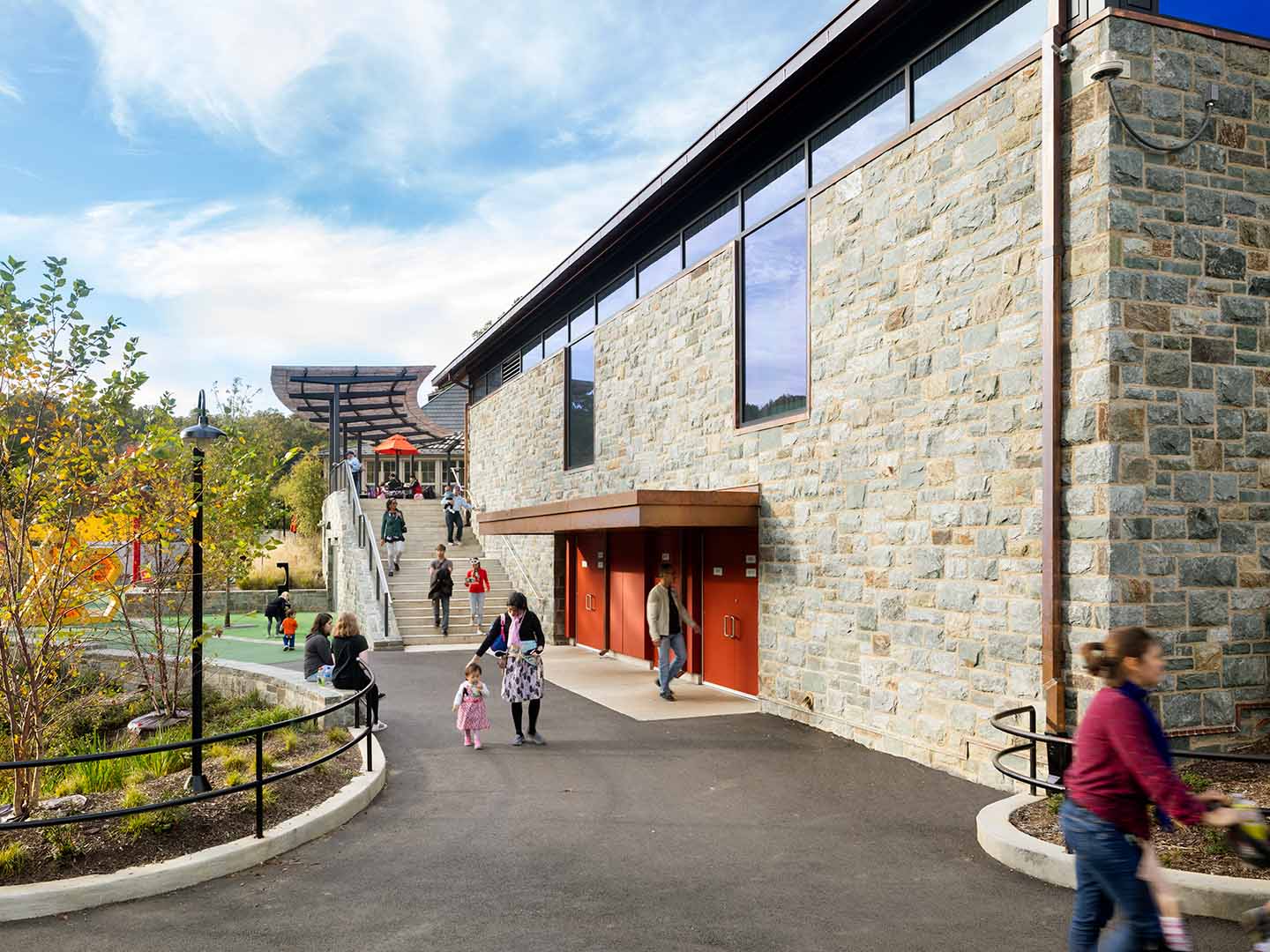 A exterior photo of the Conservation Pavilion with people walking.