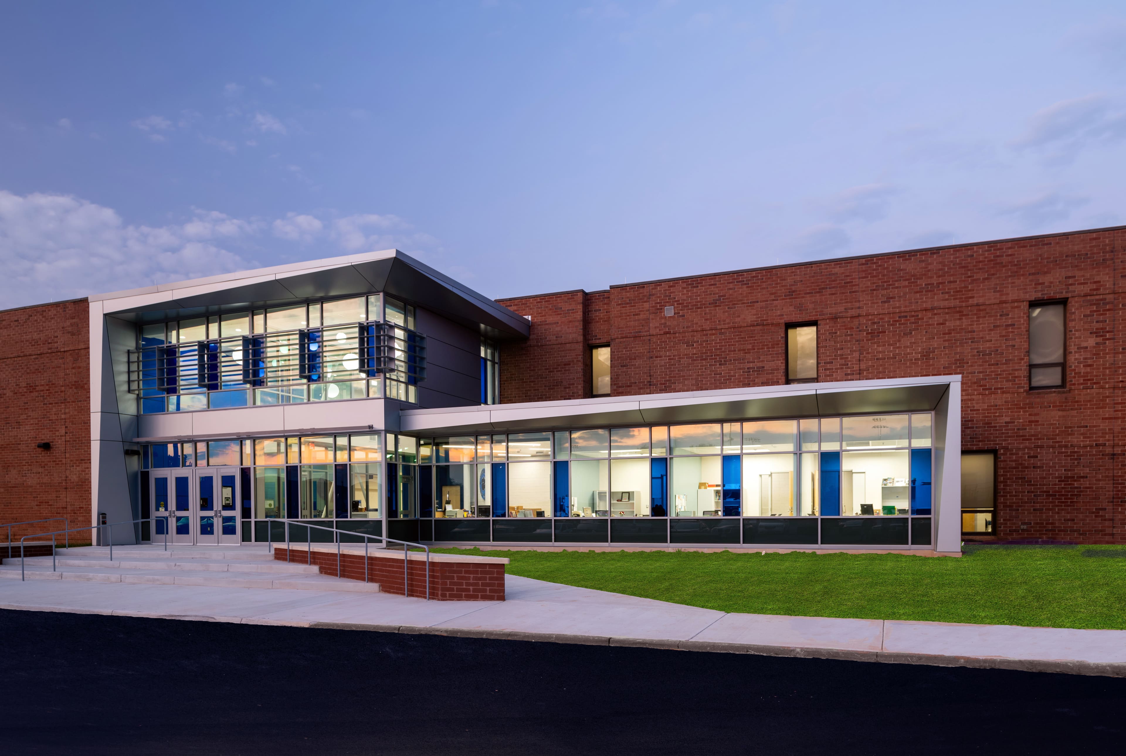 A photo of the brick and glass windowed exterior of Courtland High School.