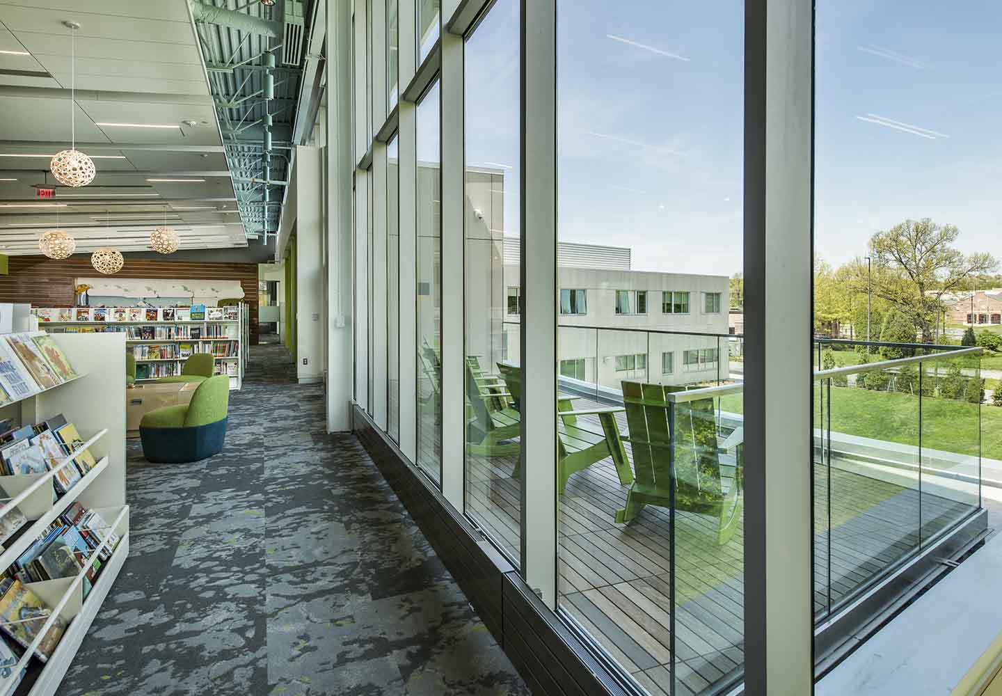 A photo of the library's upper-level reading terrace overlooking a grove of trees.