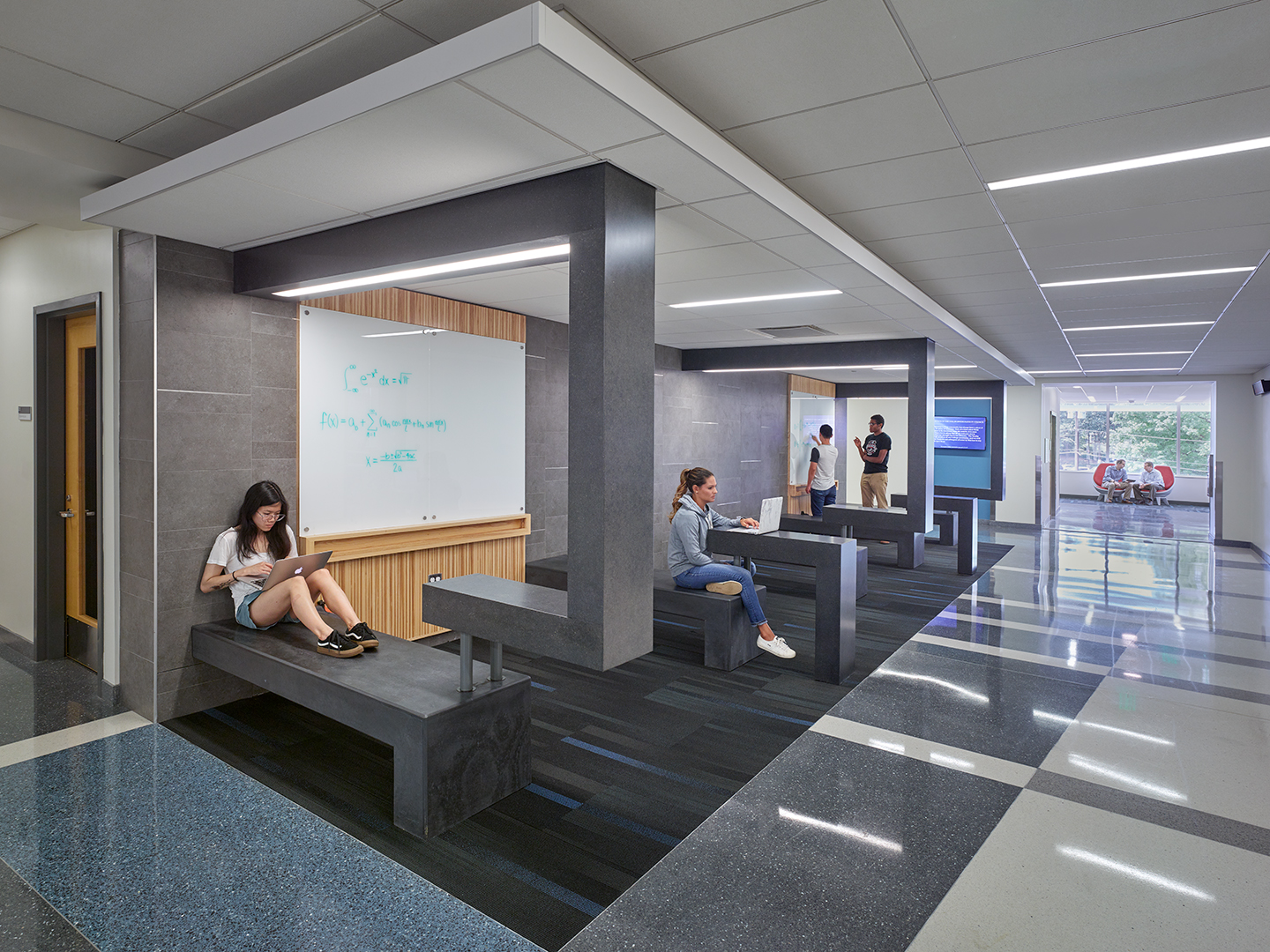 A photo of students studying at tables.