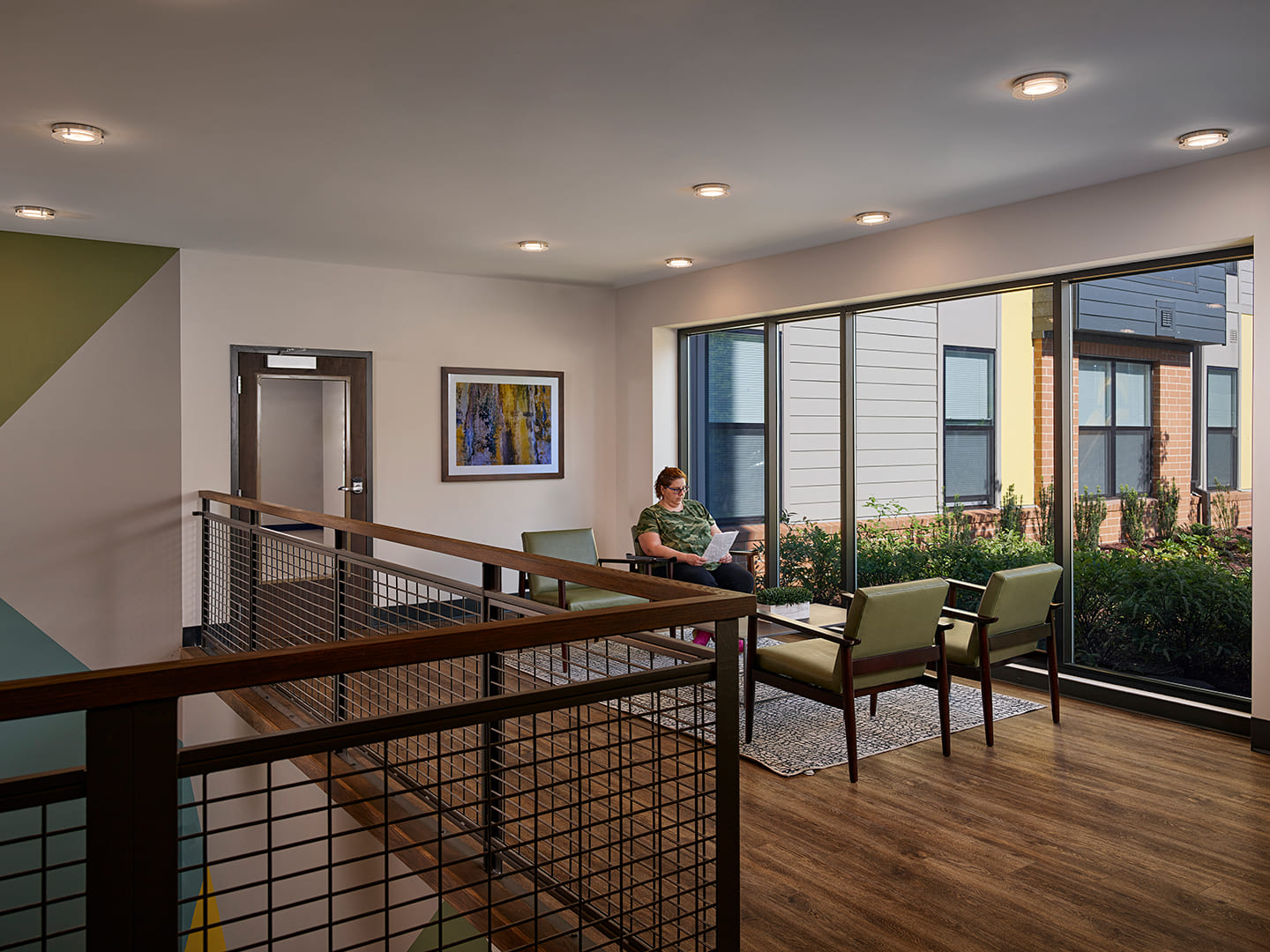 A photo of a woman in an apartment mezzanine.