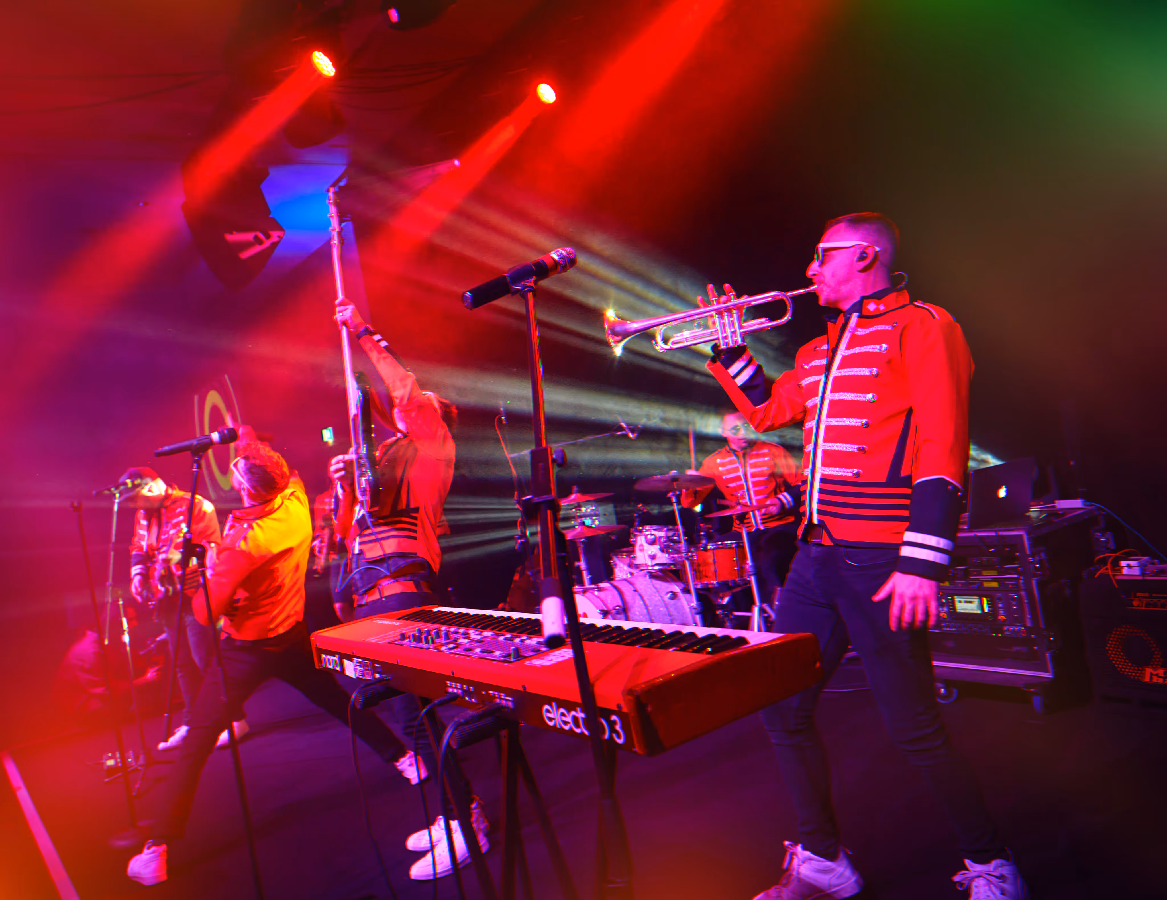 Engaging band member interacting with enthusiastic crowd, lively private party band, audience participation, unforgettable live performance.